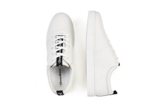 A pair of white sneakers with black laces.